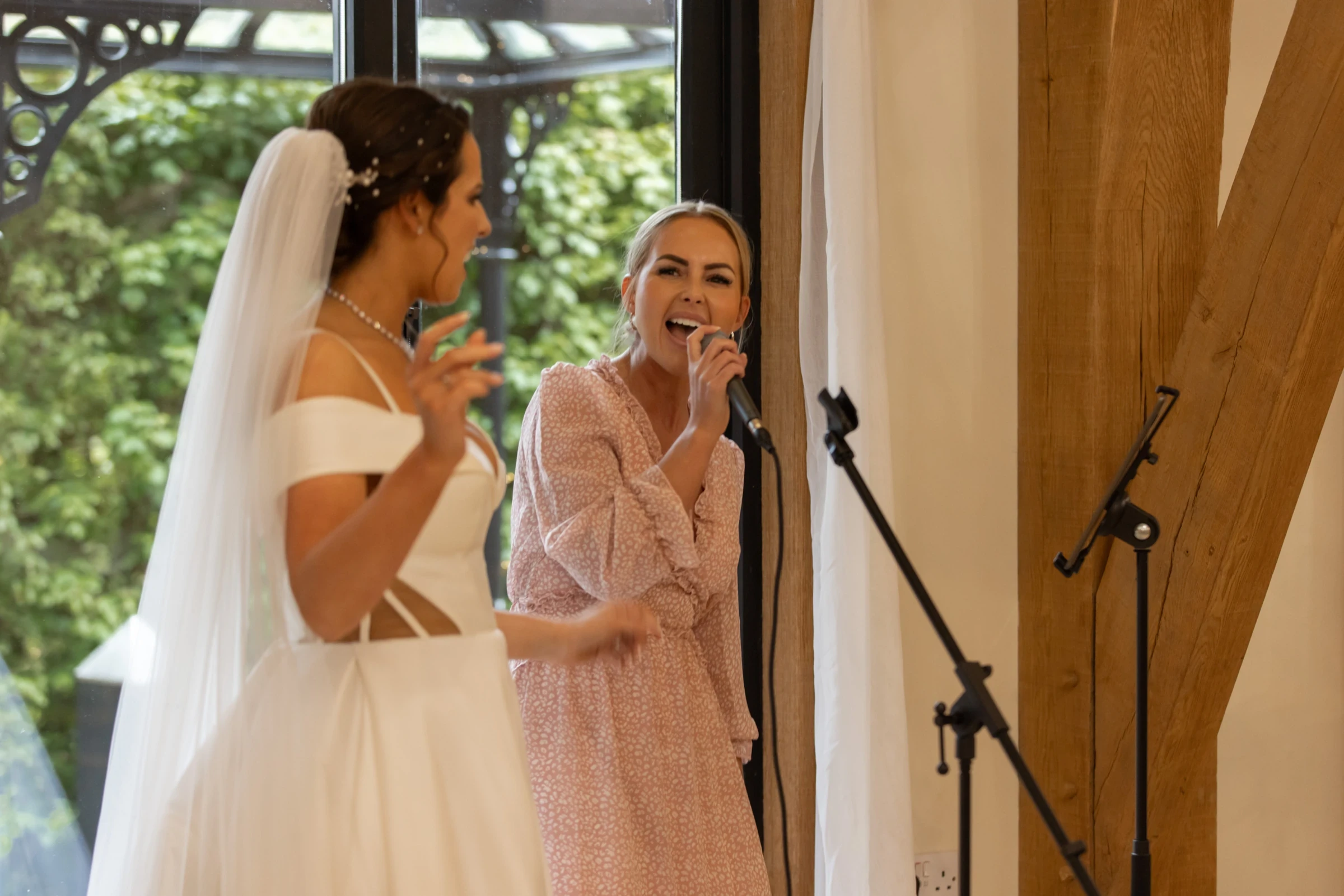 Cheryl singing beside a bride during a wedding ceremony